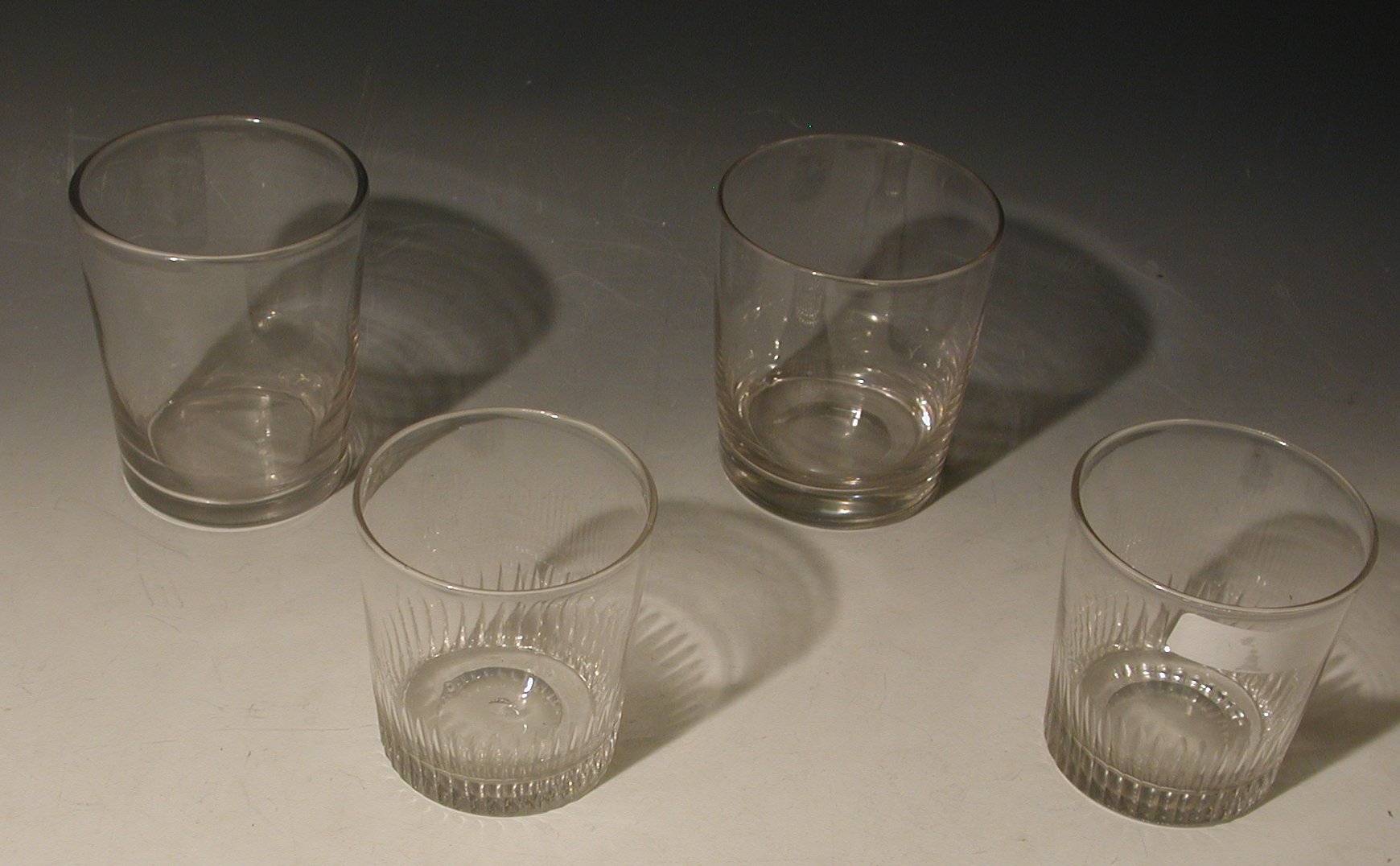 A matched set of five 19th century glass tumblers, of plain form, 11.5cm high,