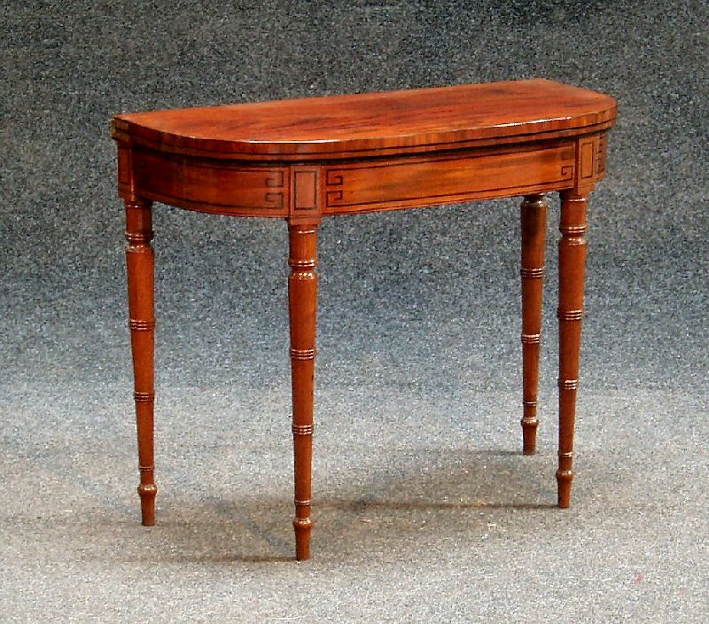 A Regency mahogany foldover card table