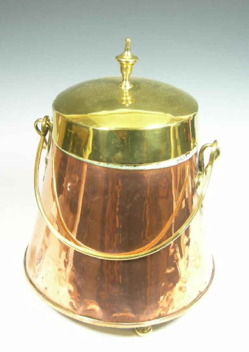 A pair of Dutch brass and copper oval buckets and covers
