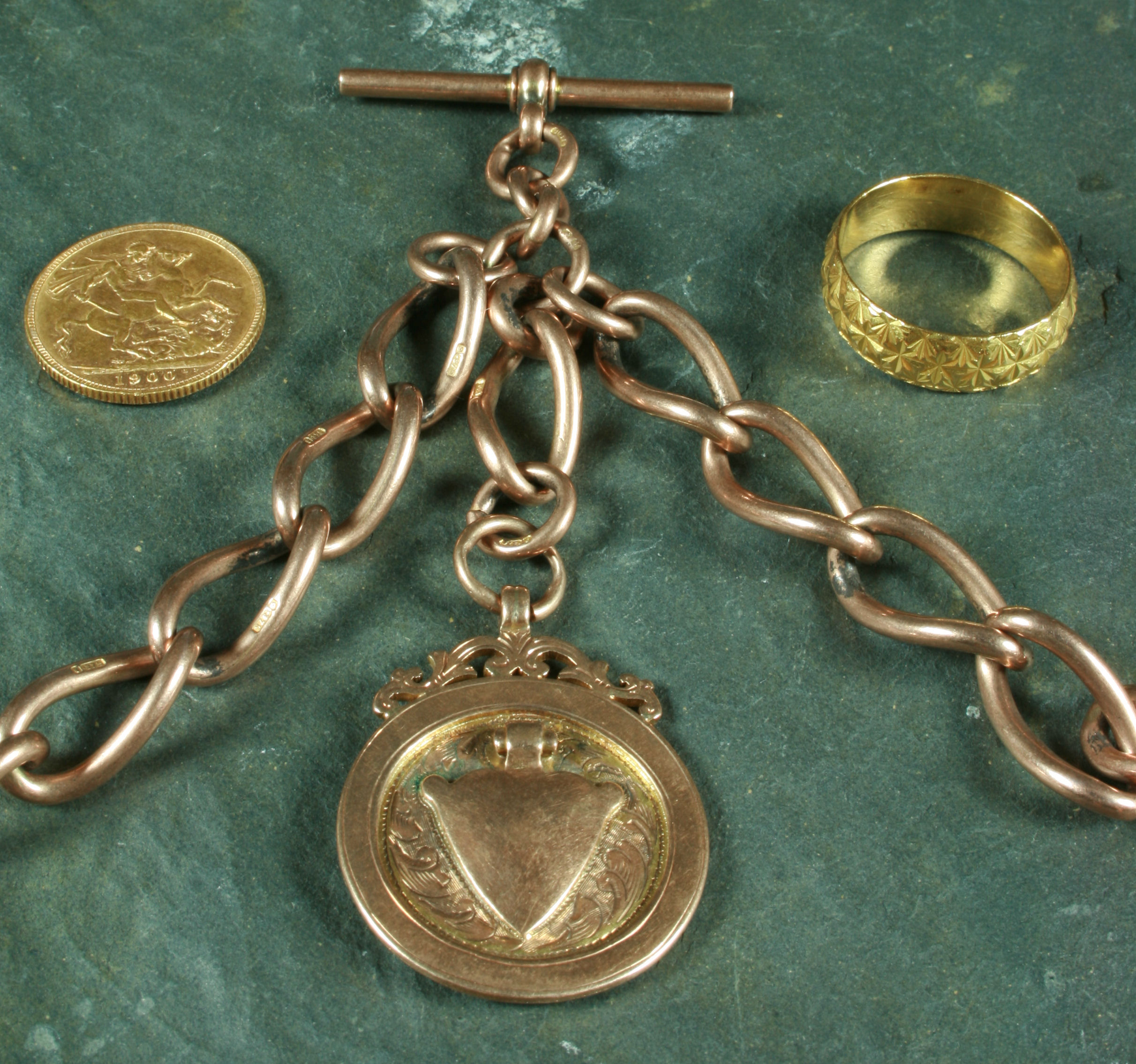 A 9ct rose gold double Albert chain,