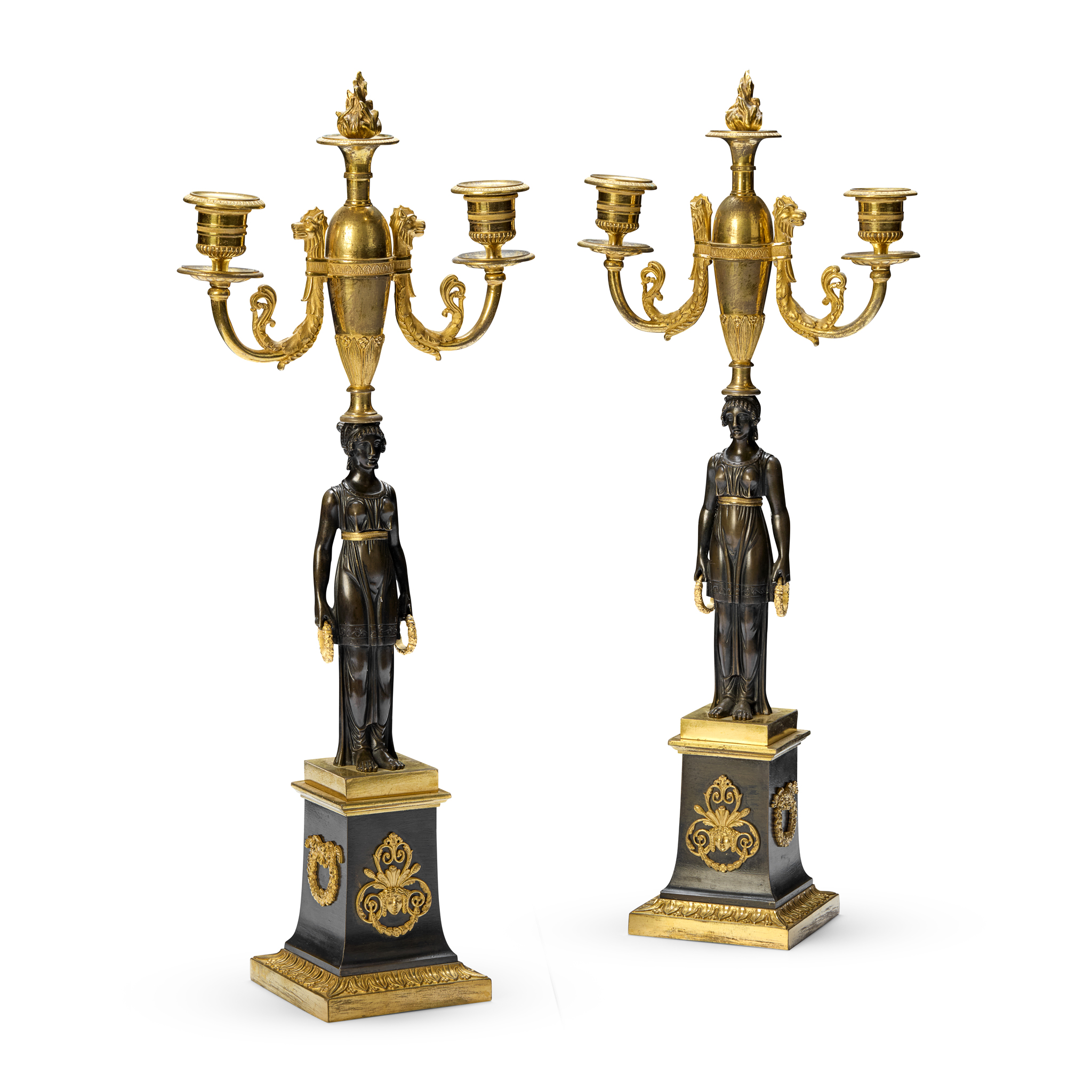 A PAIR OF FRENCH EMPIRE STYLE GILT AND PATINATED BRONZE FIGURAL TWO LIGHT CANDELABRA, IN THE MANNER OF CLAUDE GALLE