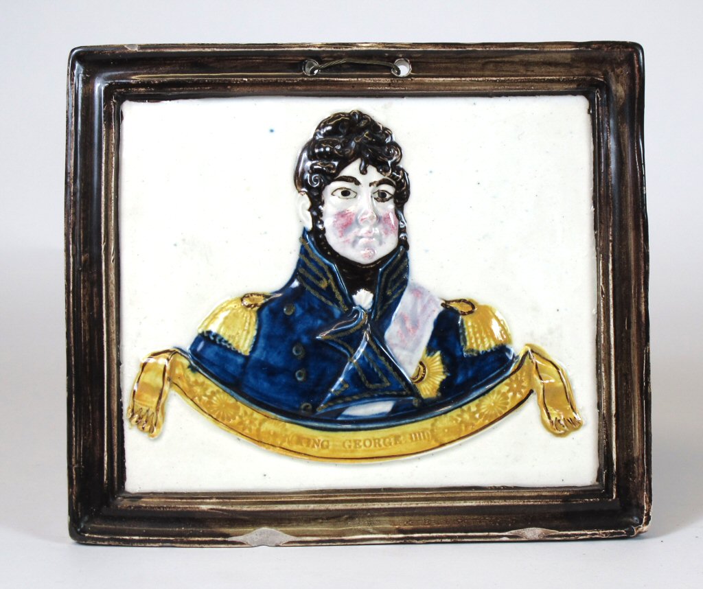 An early/ mid 19th century glazed pottery plaque of King George IV