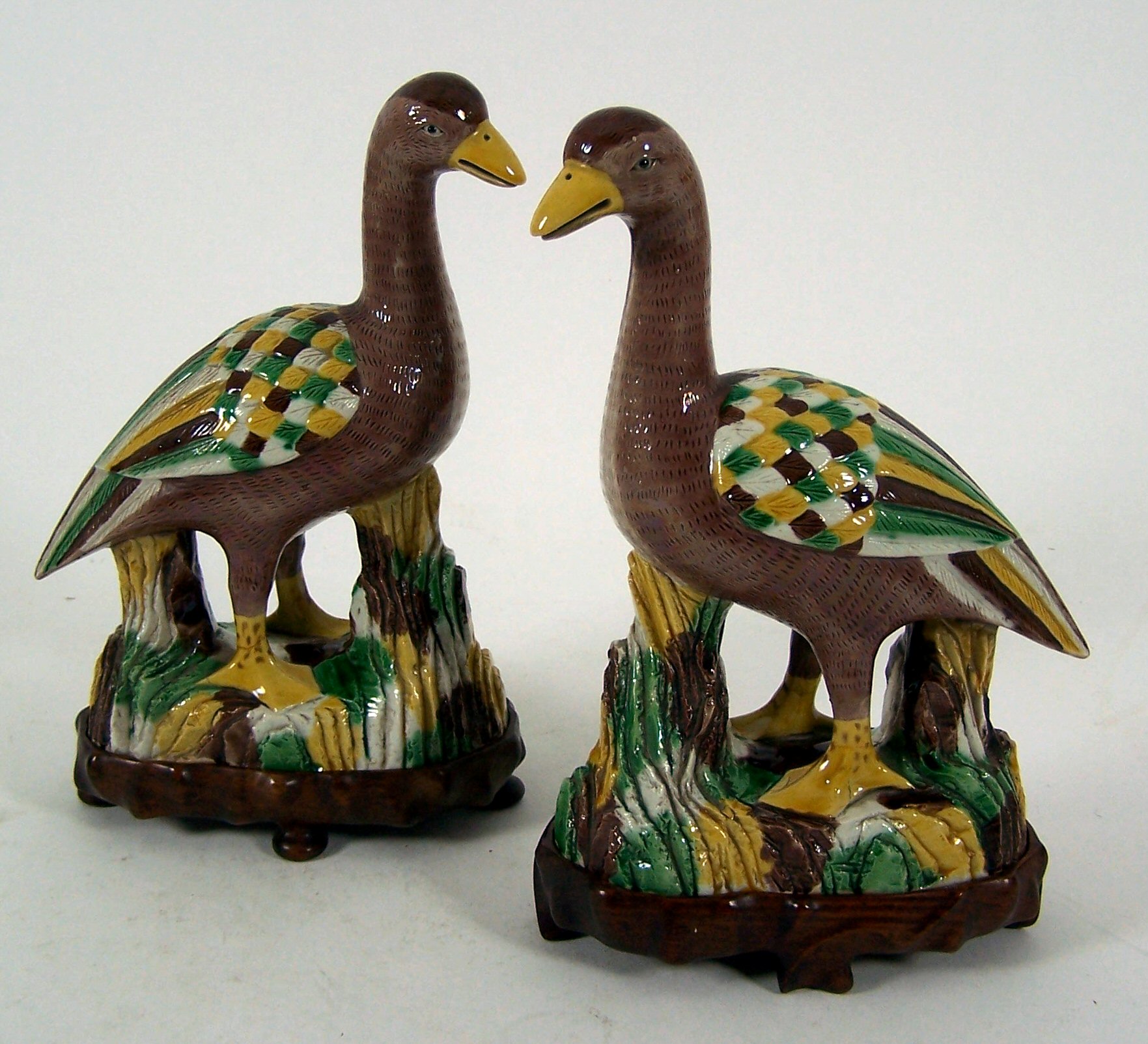 A pair of Chinese earthenware figures of geese,