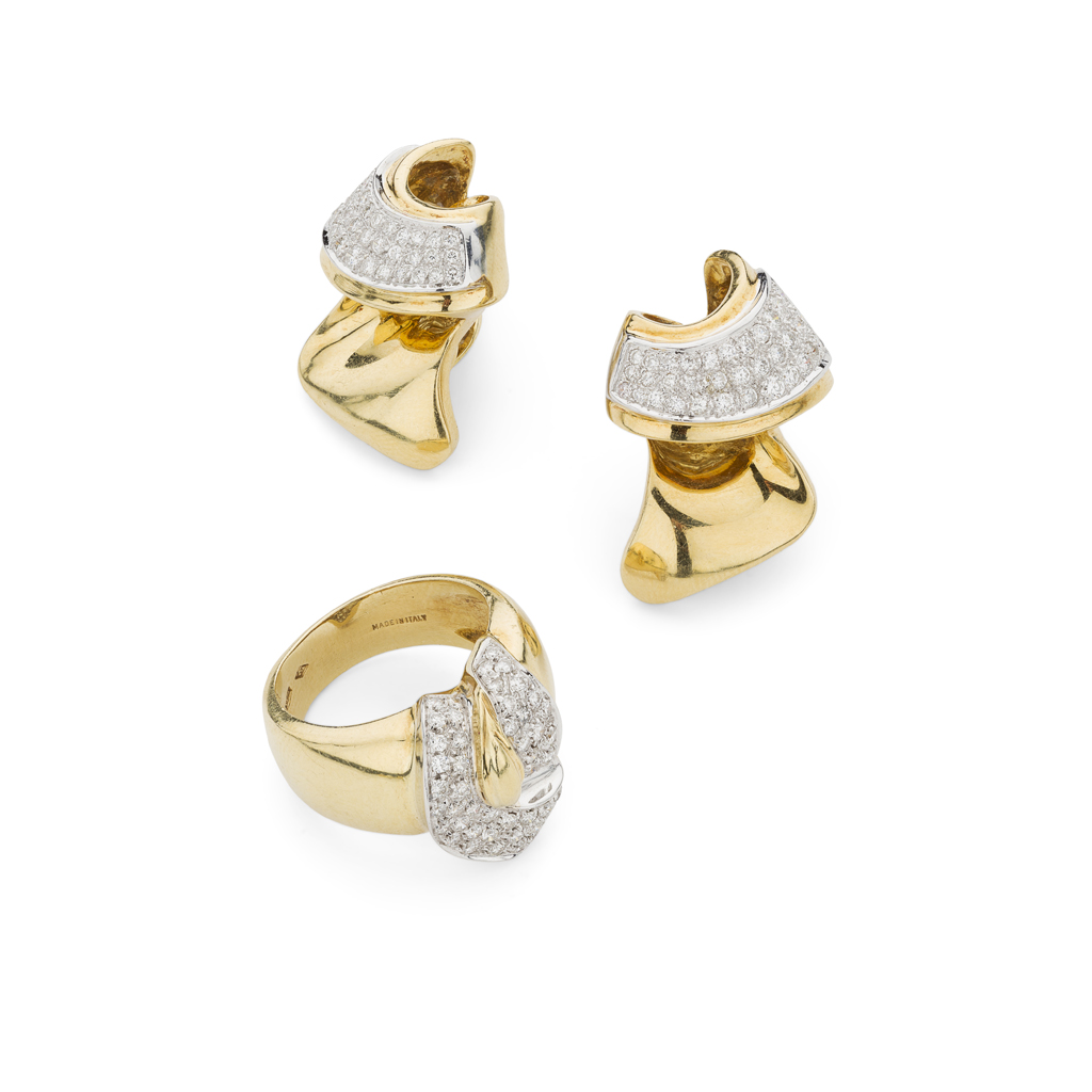 A contemporary diamond set ring and matching earrings