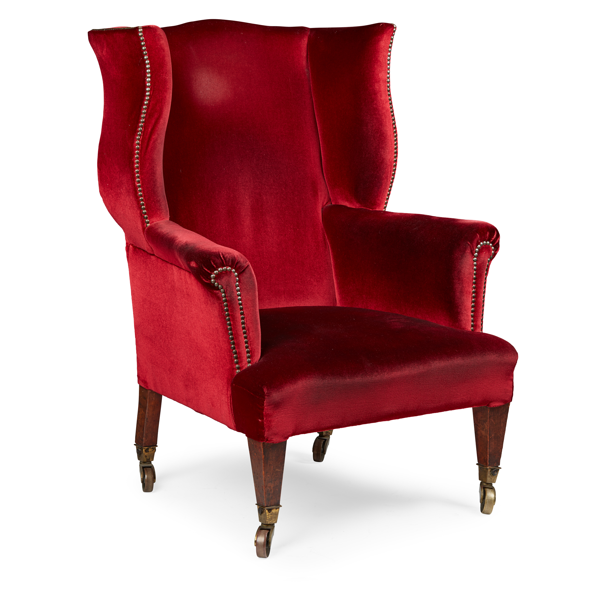 LATE GEORGE III MAHOGANY WING ARMCHAIR