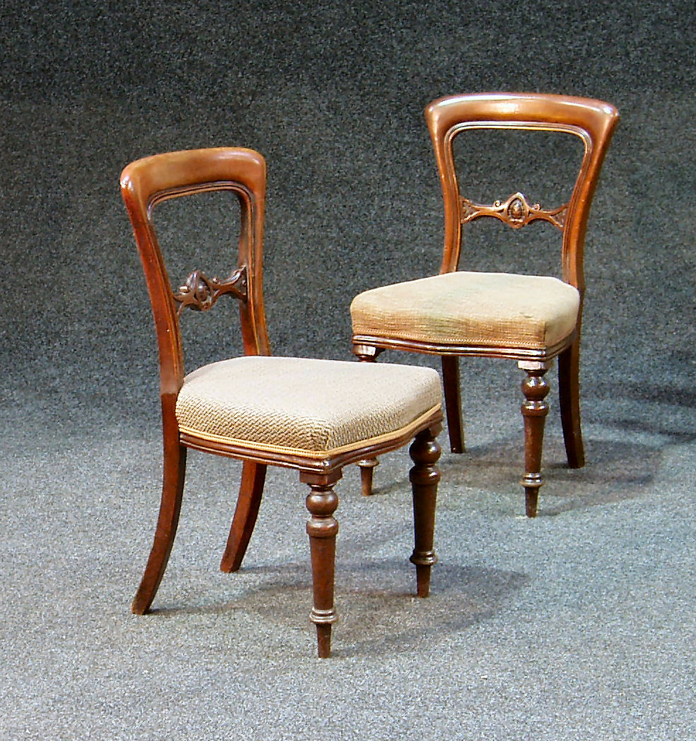 A set of six Victorian mahogany spoon back dining chairs
