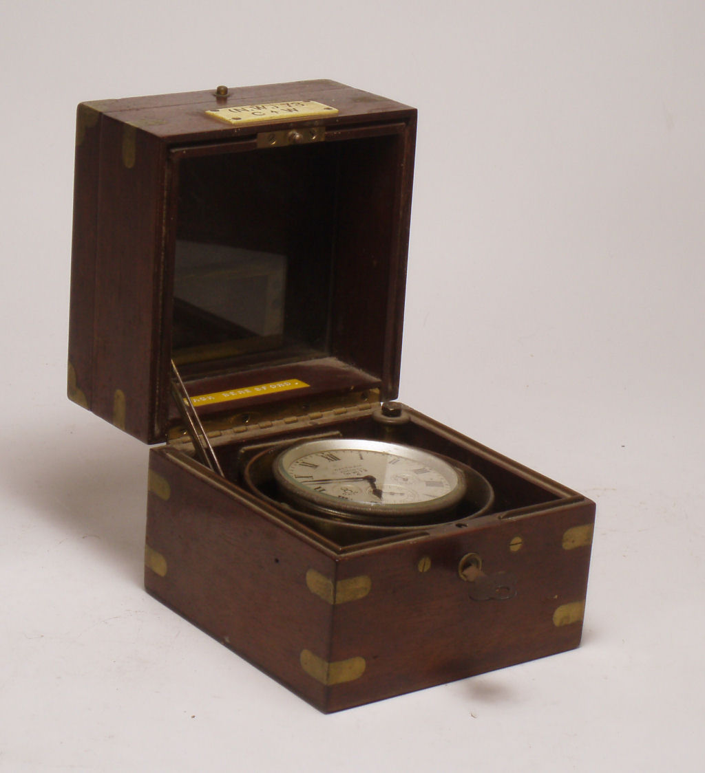 A small 19th century mahogany cased marine chronometer By Waltham Watch Co.