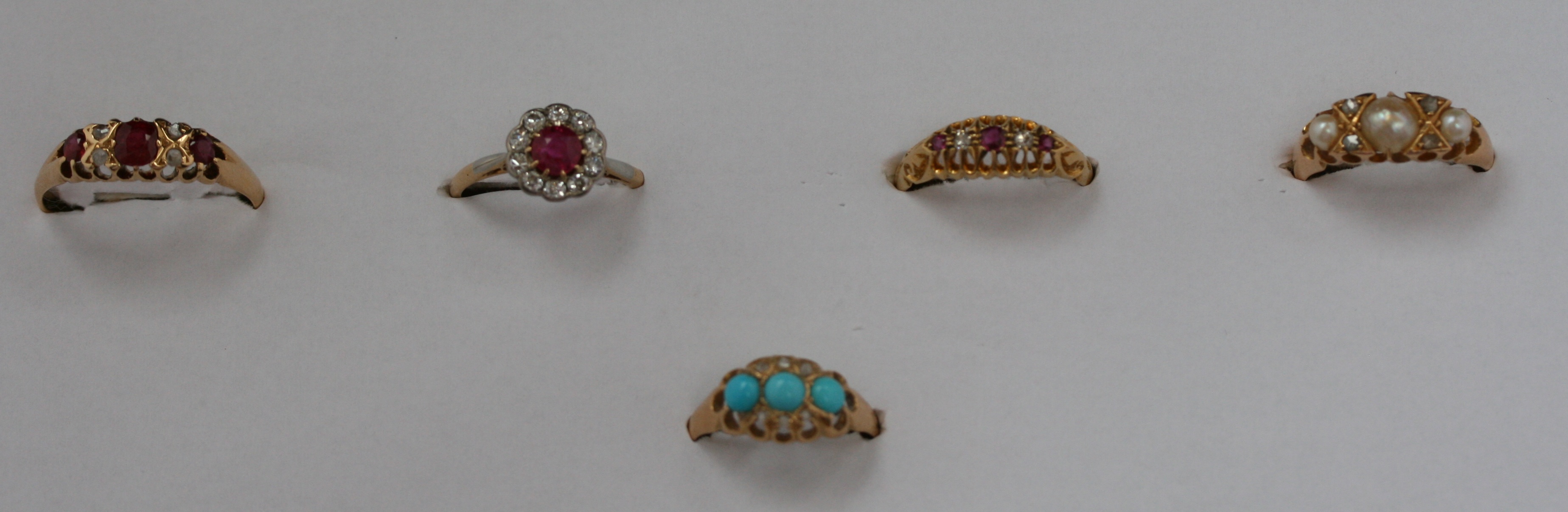 A group of five gem set dress rings