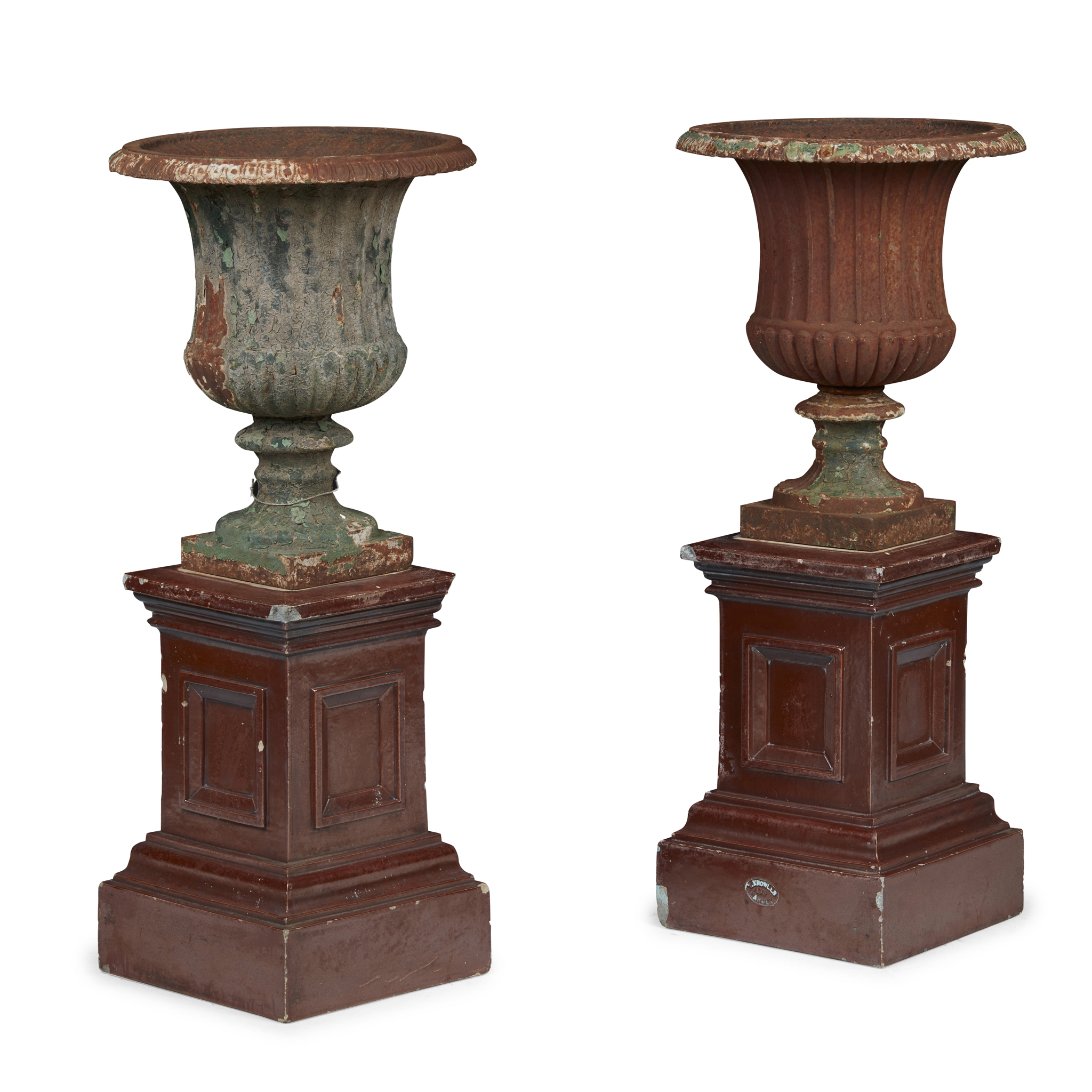 PAIR OF CAST IRON GARDEN URNS AND ASSOCIATED POTTERY PEDESTALS