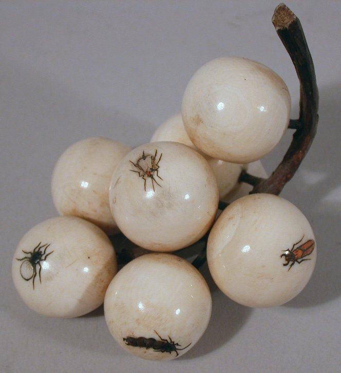 A Japanese carved ivory shibyama decorated bunch of seven cherries