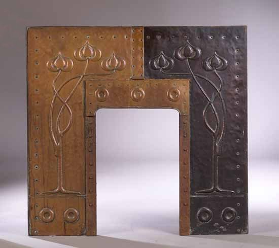 An Art Nouveau copper fire insert