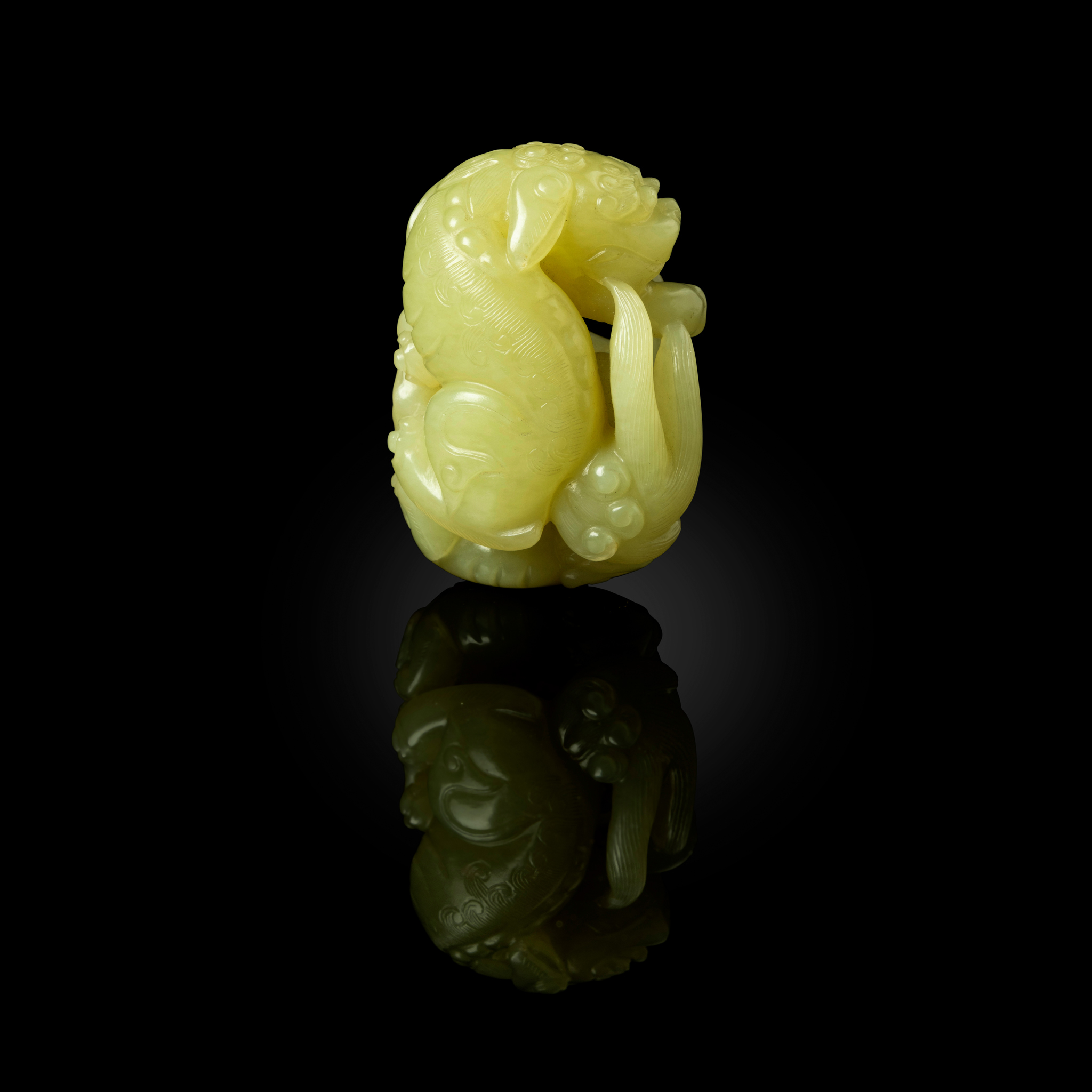 CHINESE CARVED YELLOW JADE 'LION AT PLAY' PENDANT