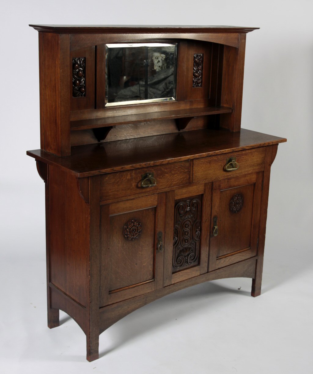 An Arts and Crafts style oak sideboard