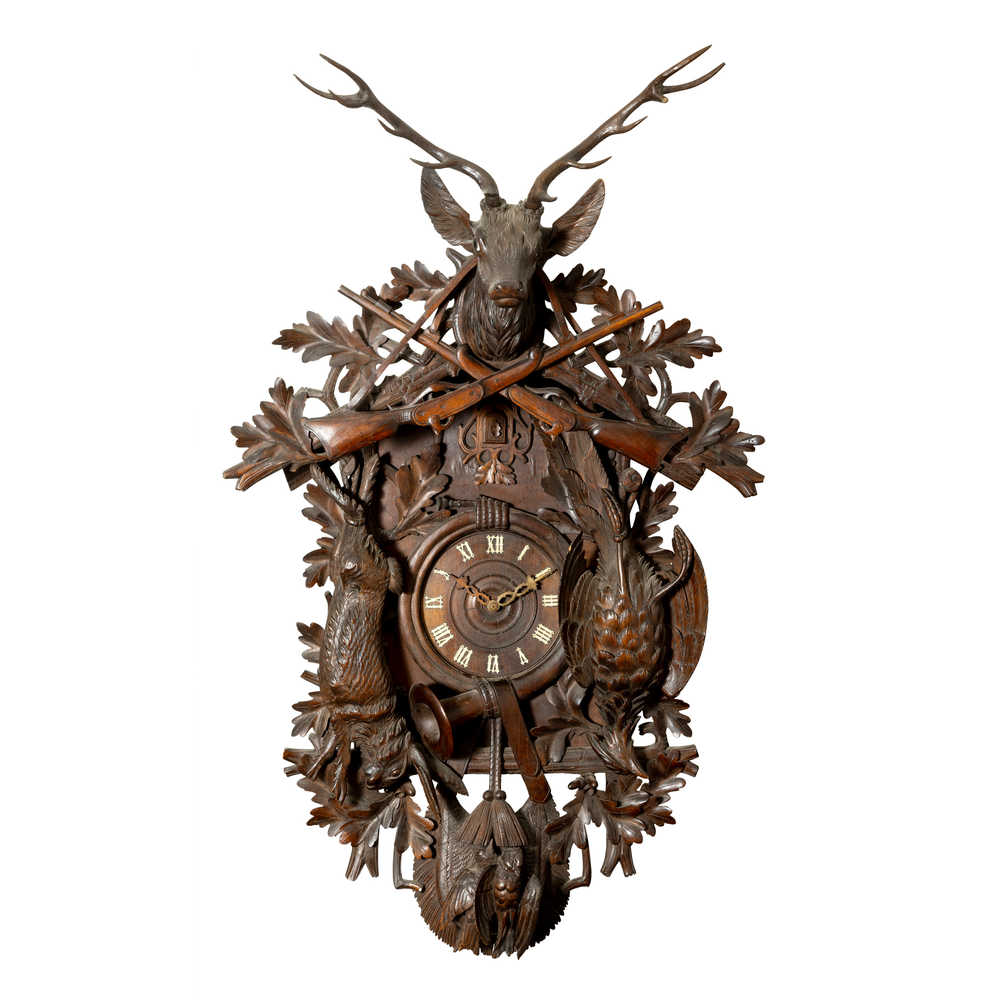 A BLACK FOREST CARVED LINDEN WOOD CUCKOO CLOCK