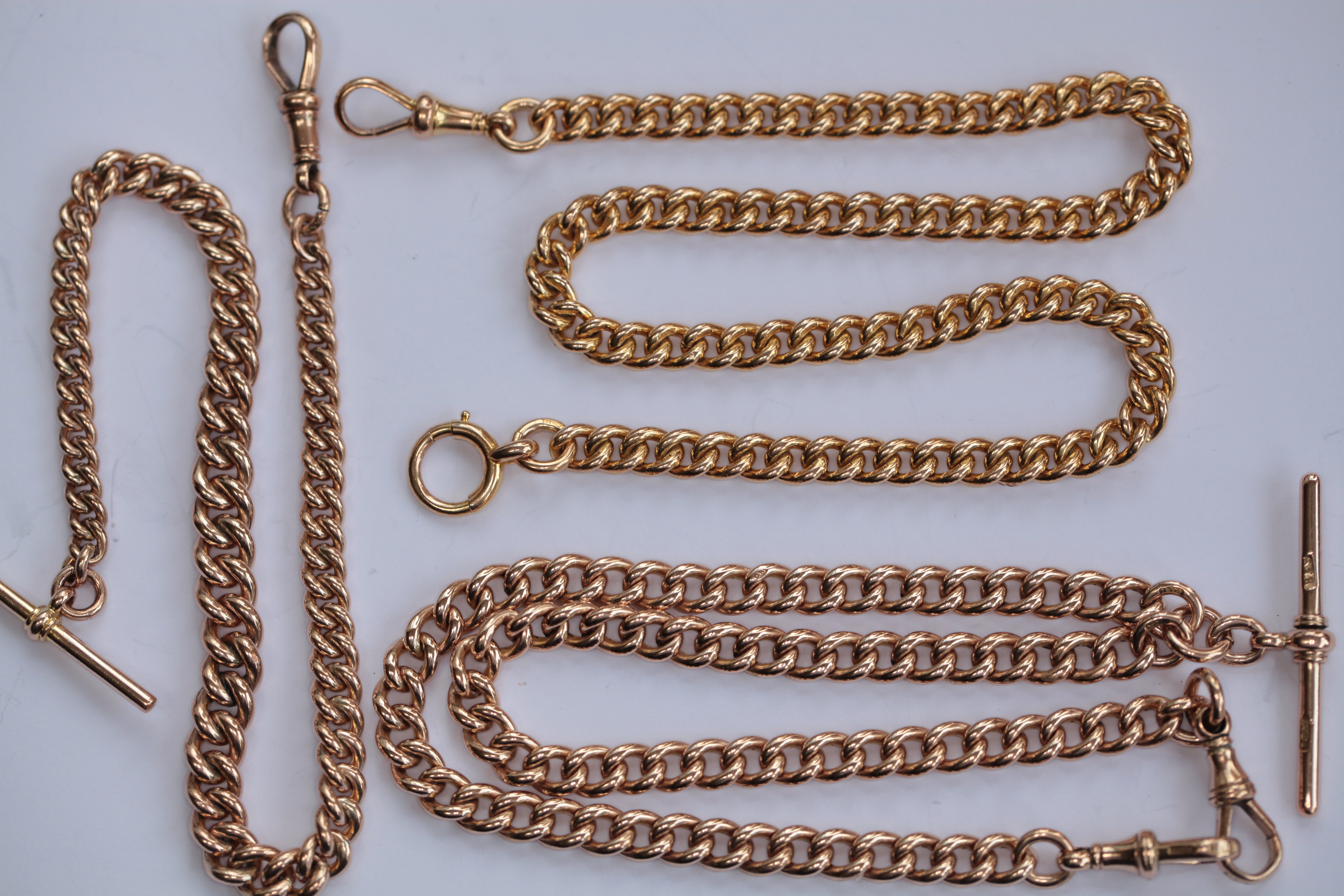 Three 9ct gold Alberts
