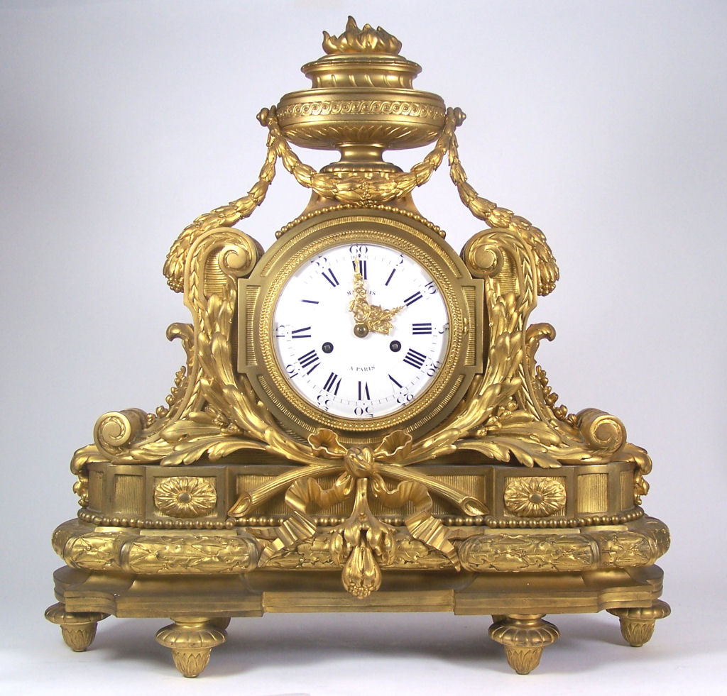 A 19th century gilt bronze mantel clock In the Louis XV style