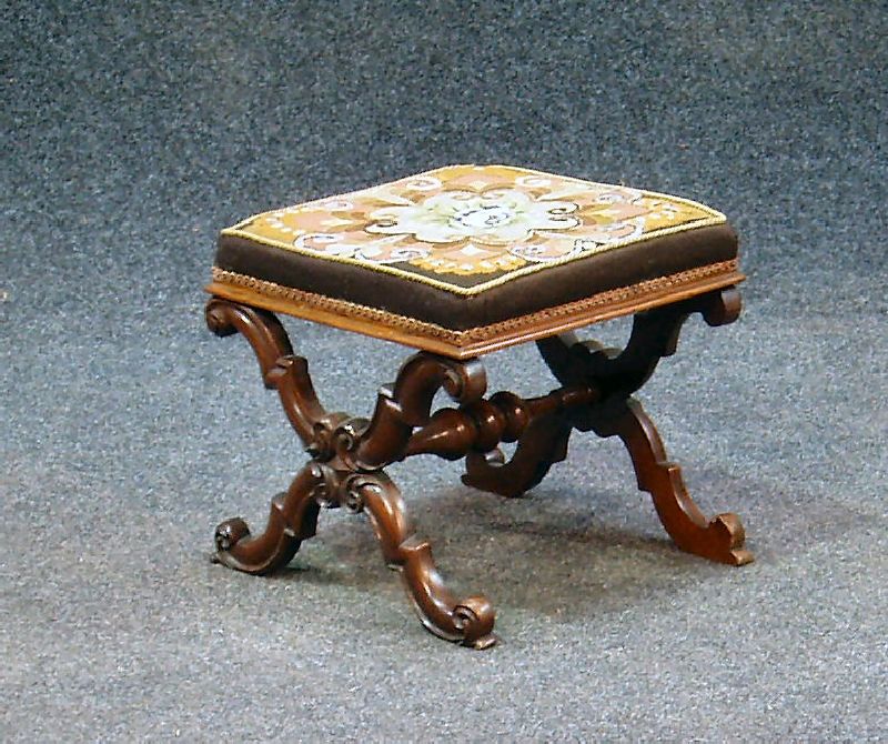 A small Victorian walnut cross-frame stool