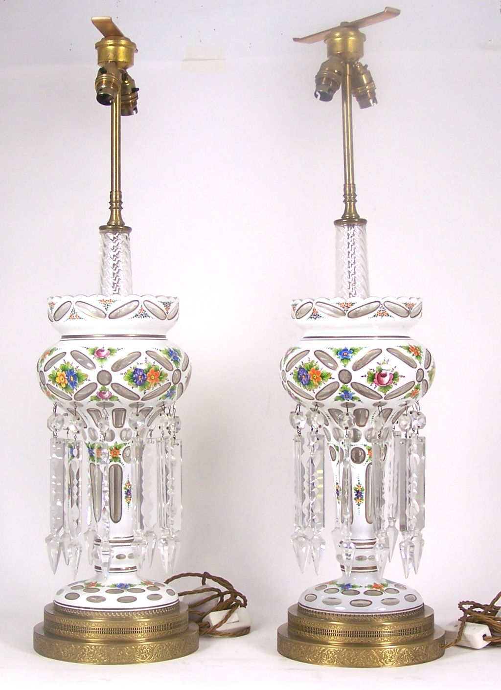 A pair of Bohemian glass white overlay lustre lamps
