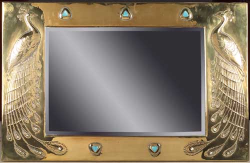 A Scottish School Arts and Crafts brass wall mirror