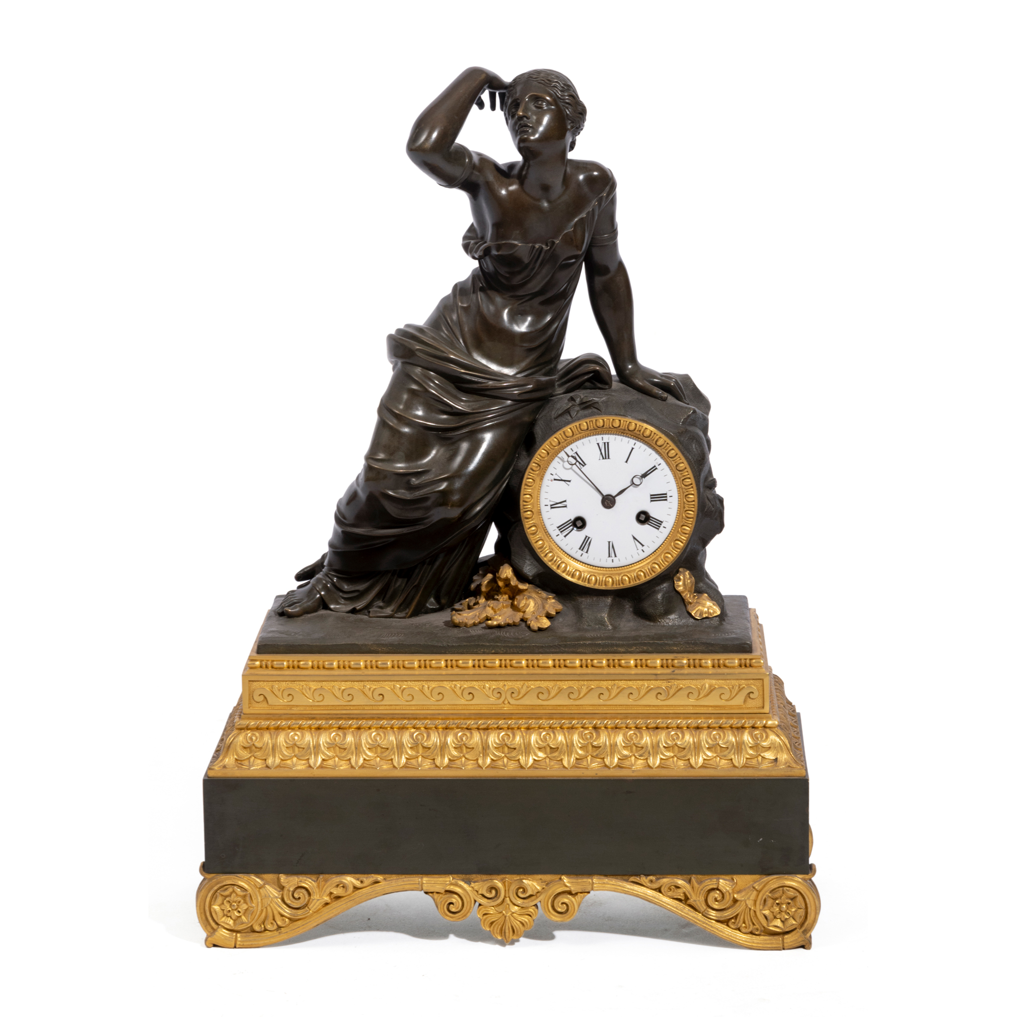 A FRENCH BRONZE AND GILT METAL MOUNTED MANTEL CLOCK