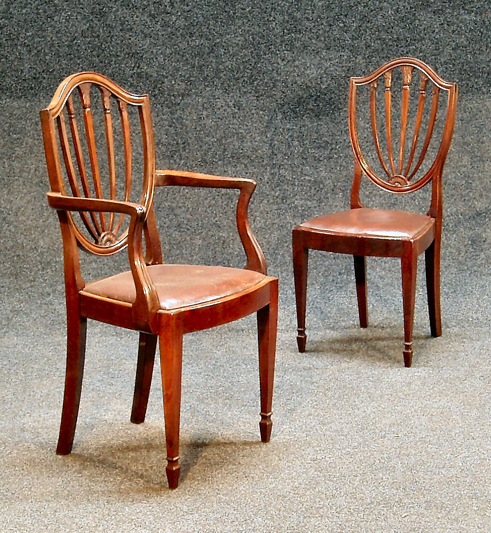 A set of eight Hepplewhite style mahogany dining chairs,