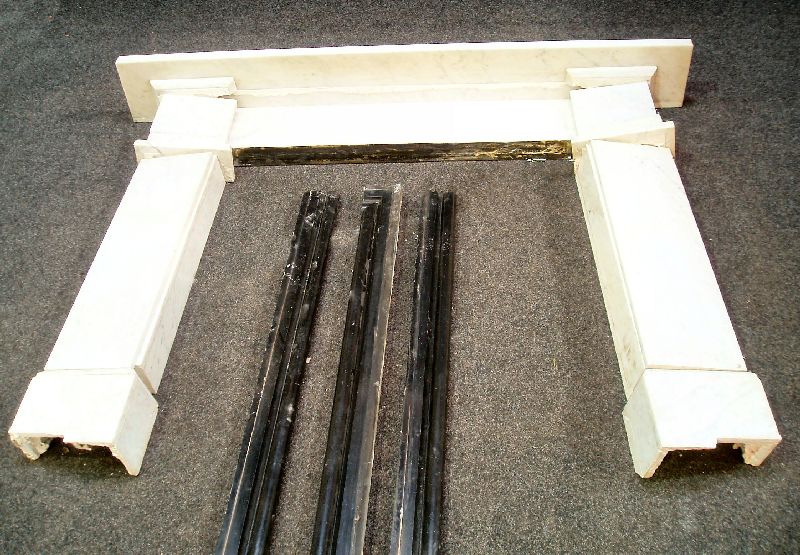 A white marble fire surround