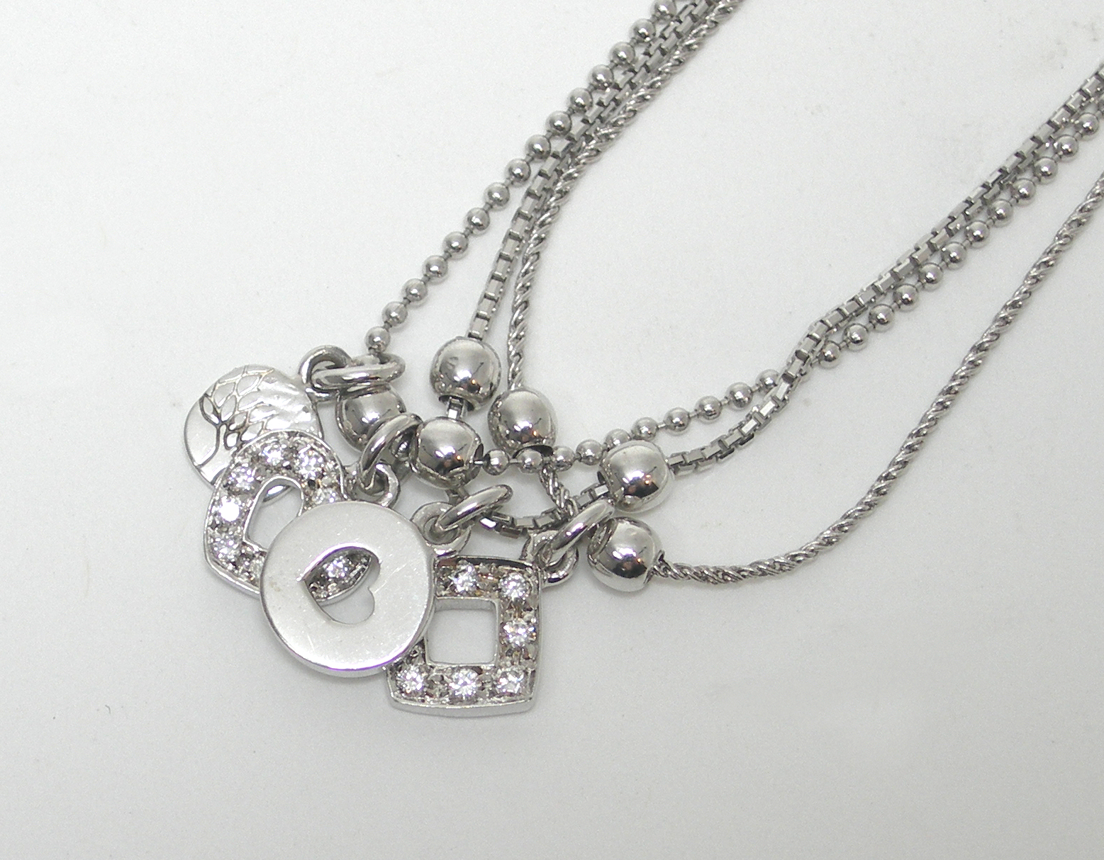 A contemporary three-row necklace,