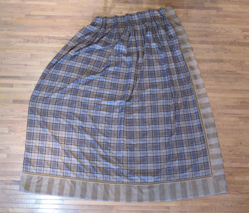 A pair of handmade brown tartan curtains