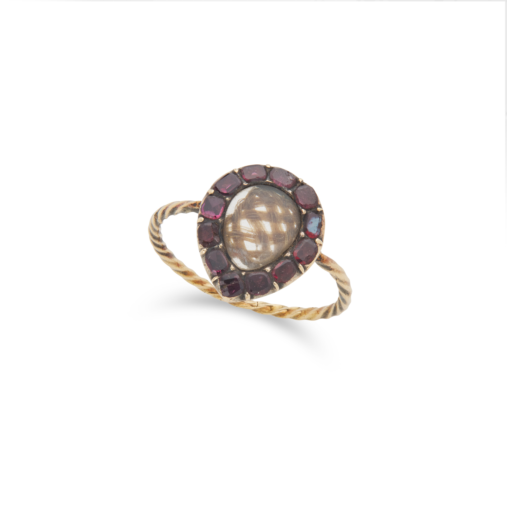 A garnet hairwork ring, circa 1800