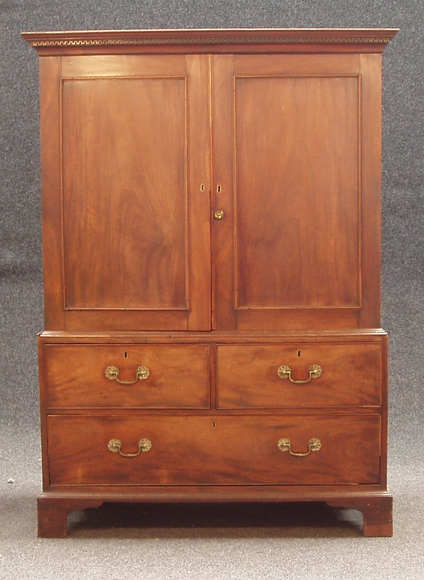 An early George III mahogany linen press,