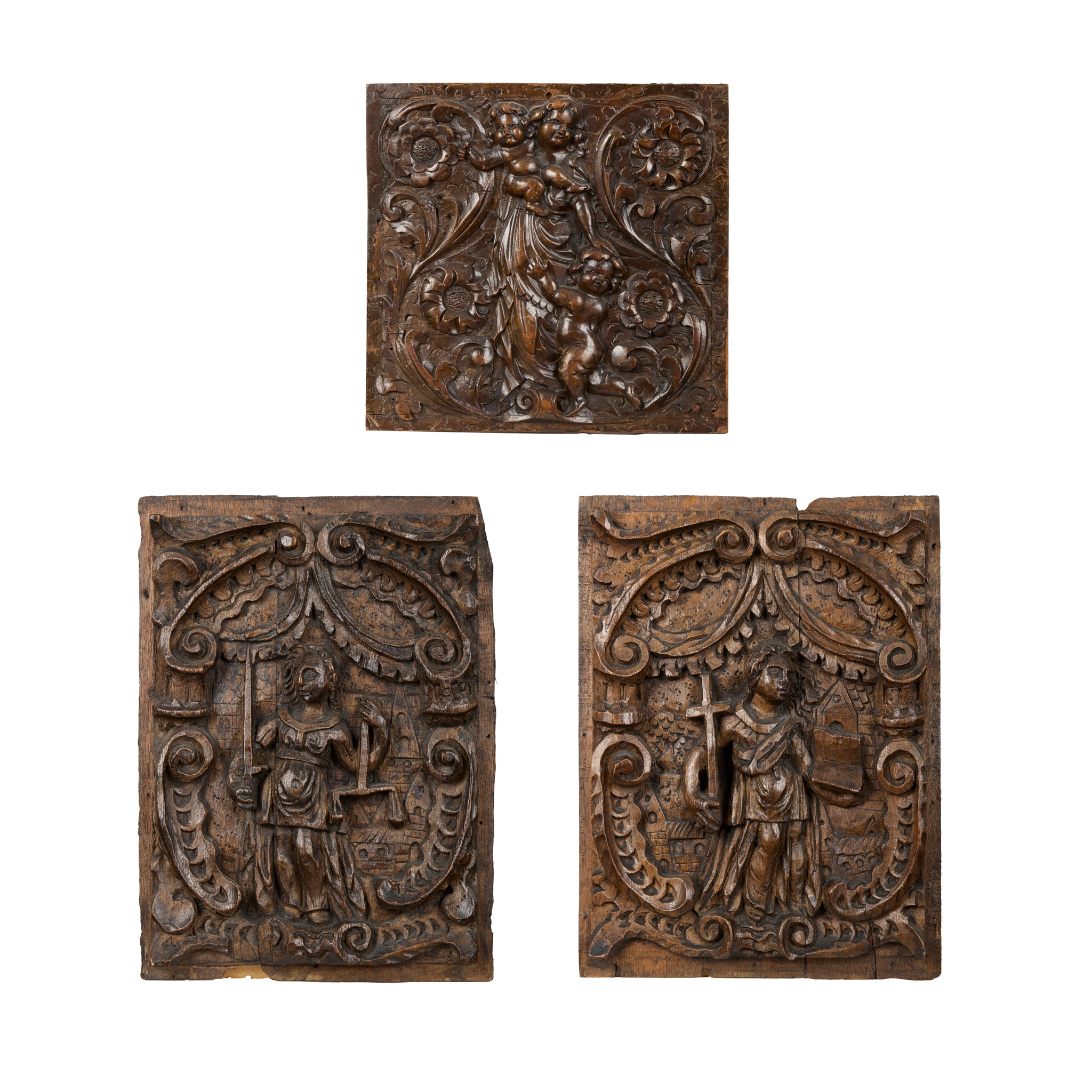 THREE CARVED OAK RELIEF PANELS