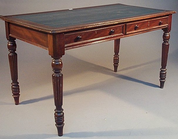 A stained mahogany writing table