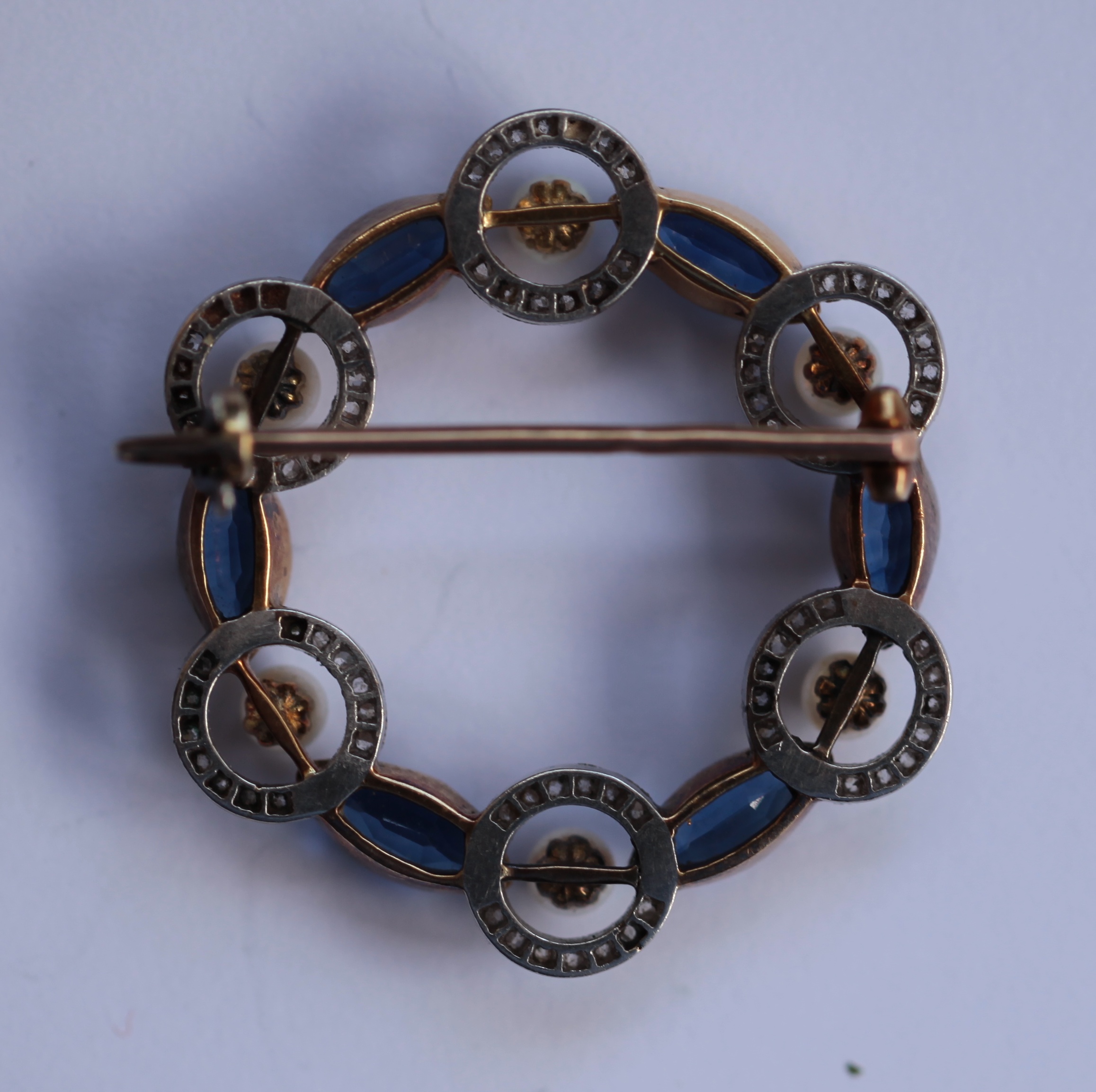 A sapphire and pearl set brooch