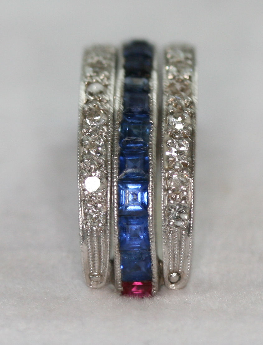 A multi-gem set full-eternity ring of swiveling design