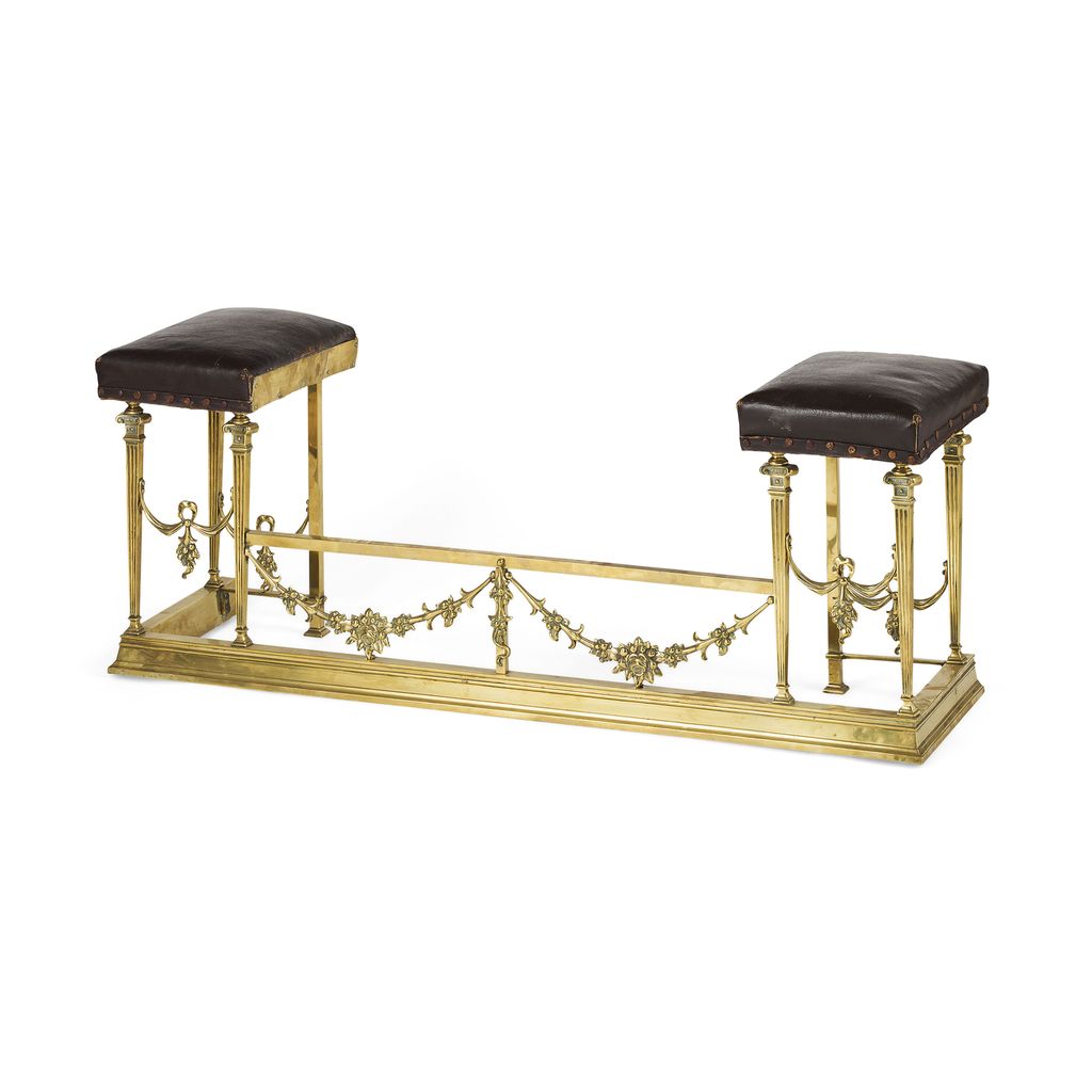 EDWARDIAN BRASS AND LEATHER UPHOLSTERED CLUB FENDER