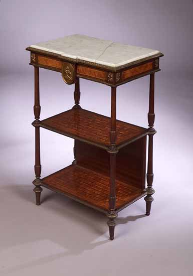A kingwood and birds eye maple three tier étagère
