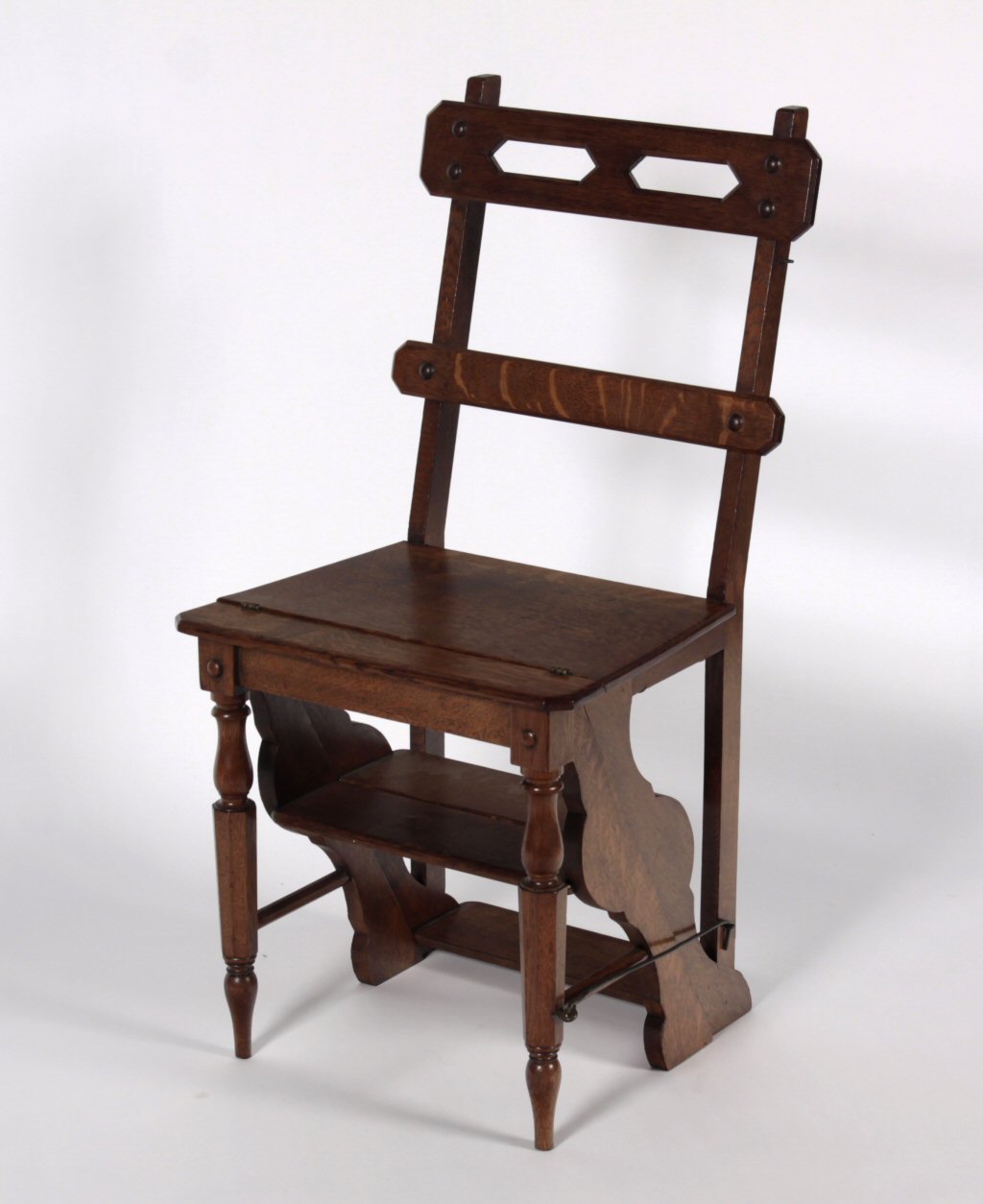 A late 19th/early 20th century oak metamorphic chair