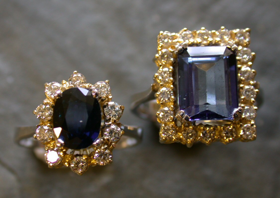 An 18ct gold mounted sapphire and diamond cluster ring,