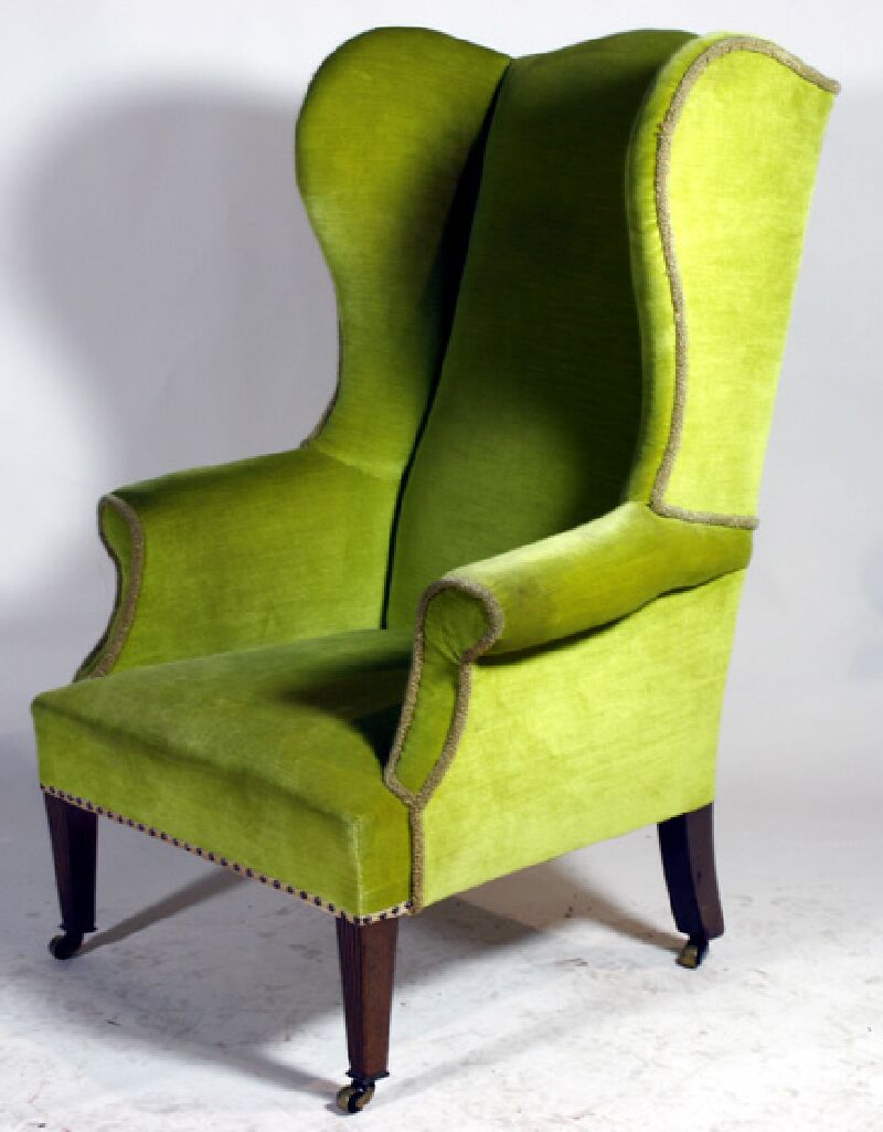 A 19th century mahogany tall wingback armchair