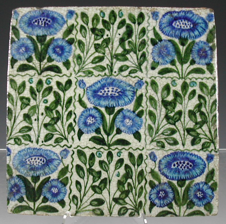 William de Morgan (1839-1917) A 'Bedford Park Daisy' and 'Flying Leaf' tile,