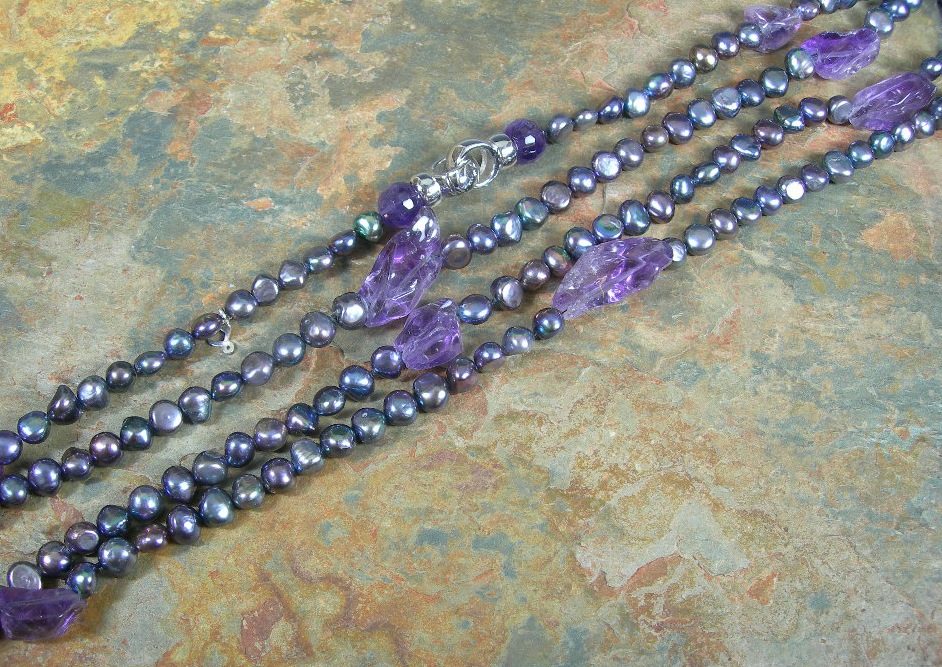 A cultured freshwater pearl and amethyst bead necklace,