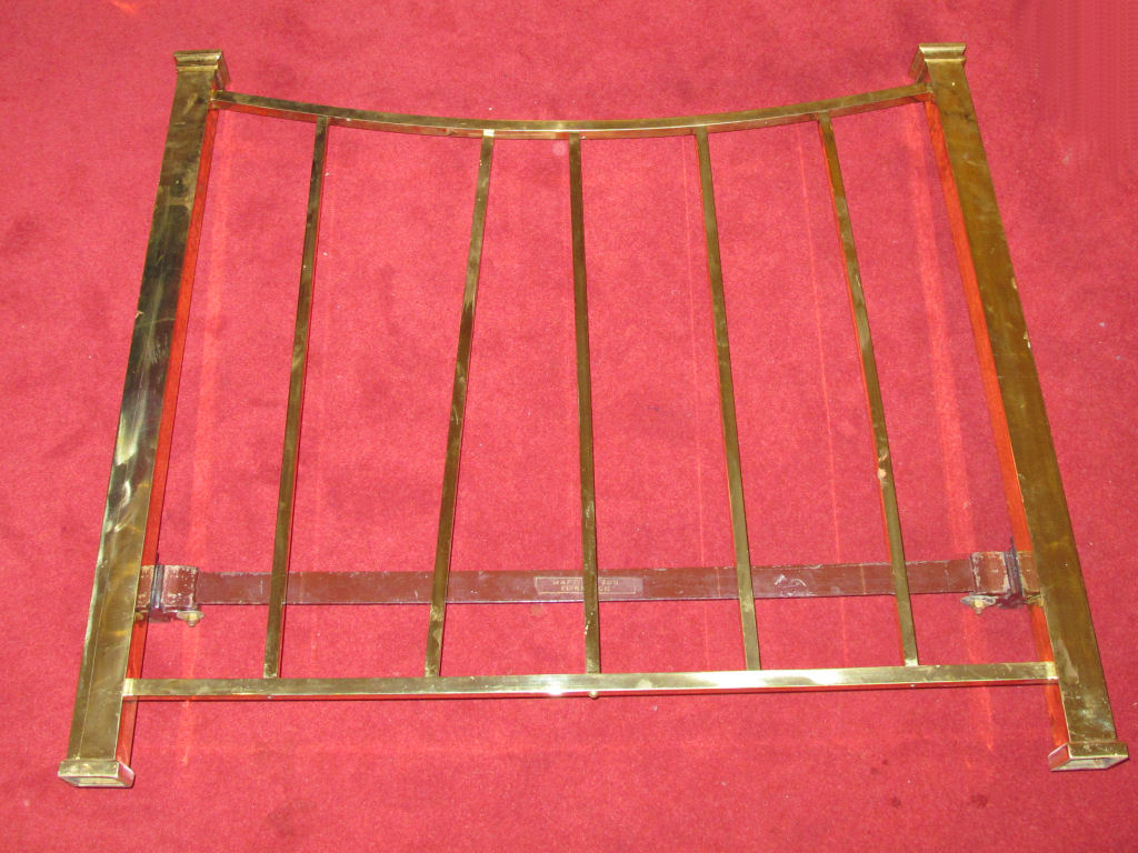 A pair of brass single beds