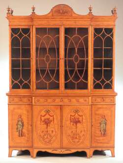 An early 20th century satinwood breakfront bookcase