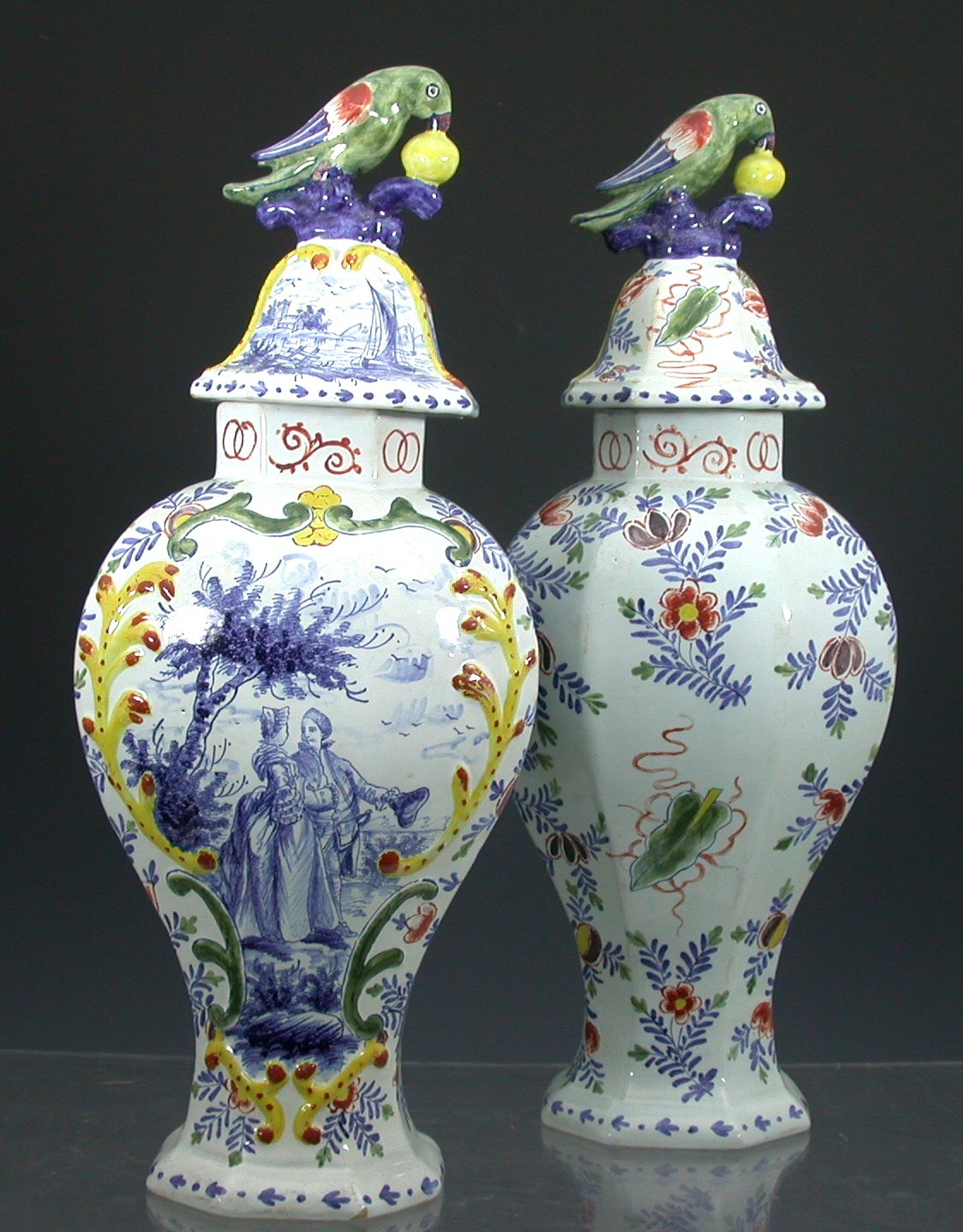 A pair of 19th century Delft vases and covers,