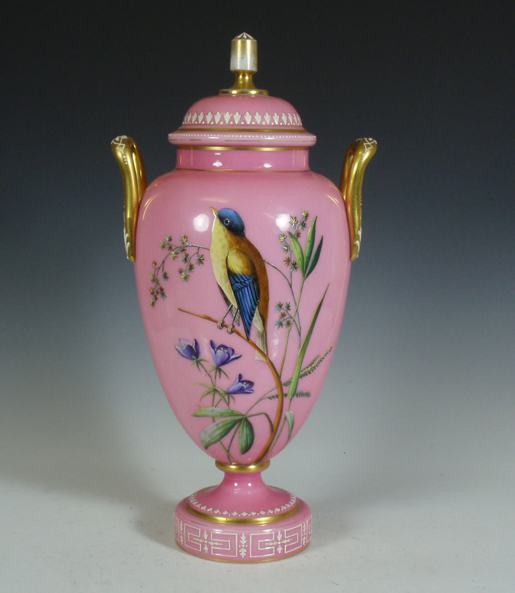 A 19th century pink opaque painted glass vase and cover