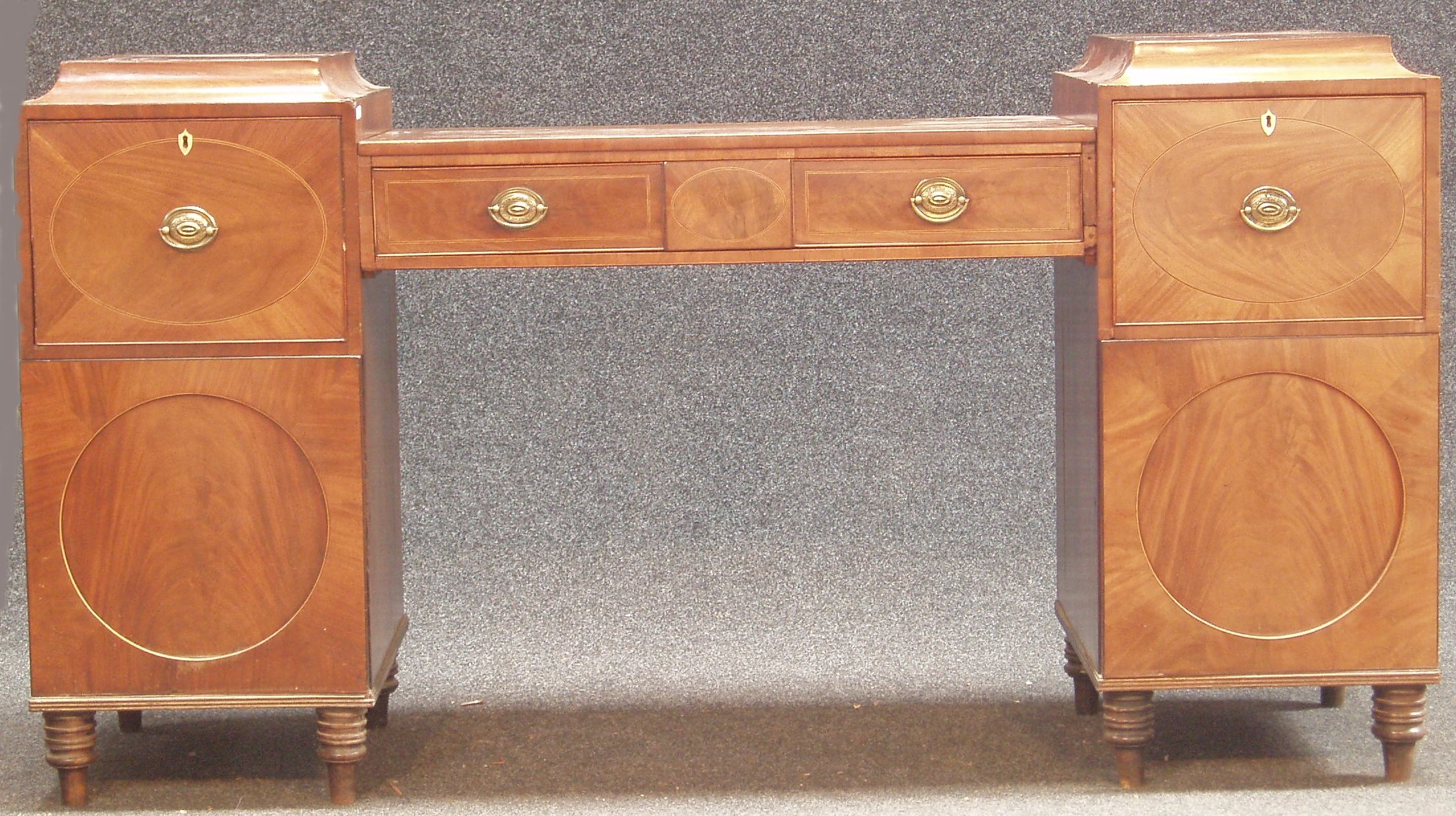 A William IV mahogany, boxwood and ebony strung pedestal sideboard,