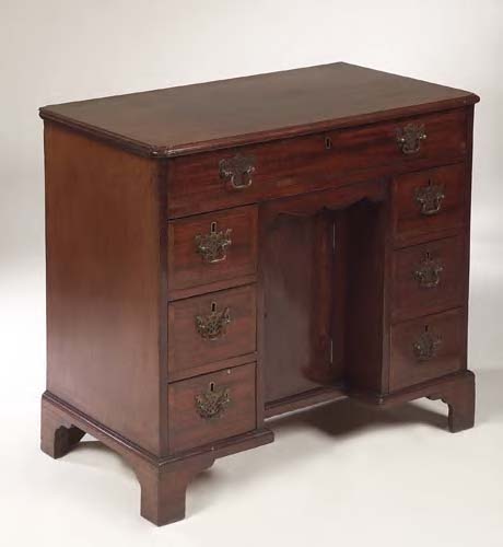 A George III mahogany crossbanded kneehole desk,