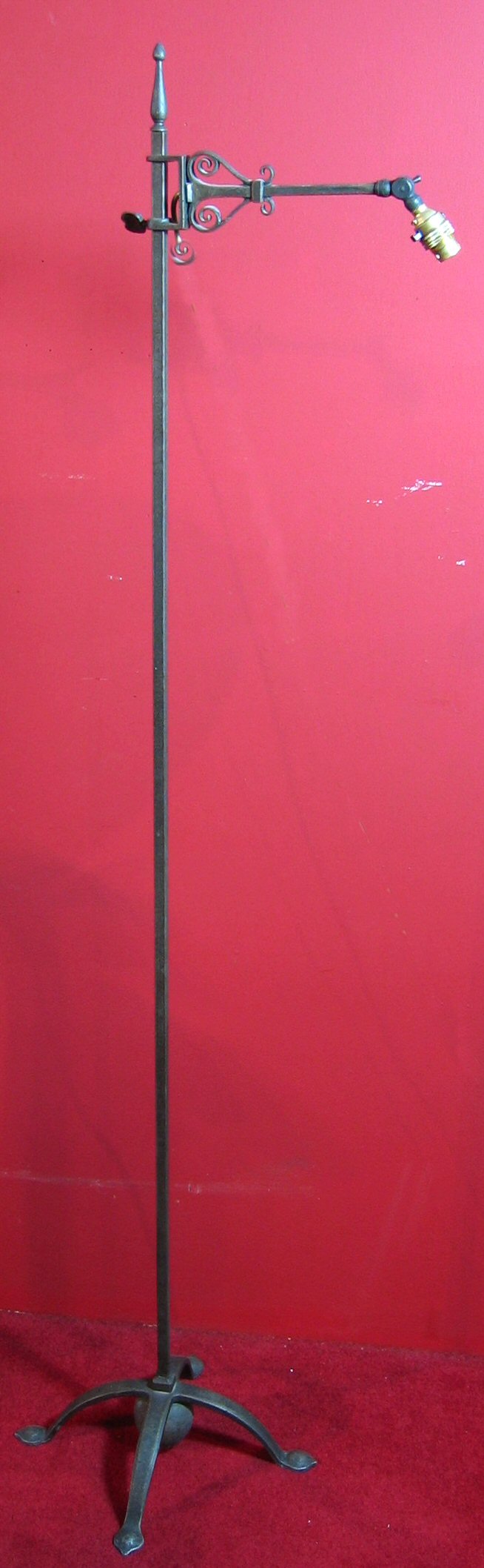 Three Arts and Crafts wrought iron floor lamps,