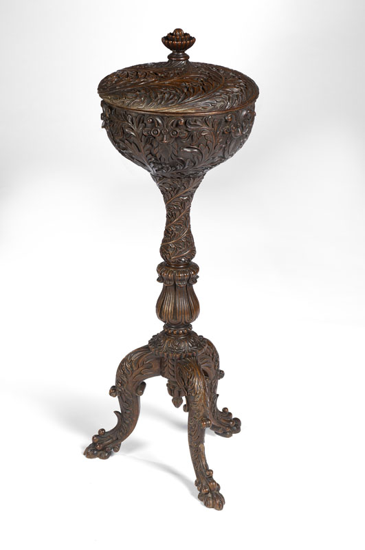 A mid 19th century Anglo-Indian carved rosewood circular teapoy