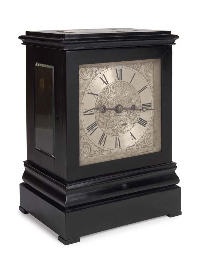 An early 19th century ebony veneered mantel clock,